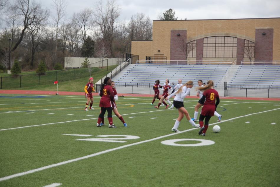Freshman, Kirsten Davis, passes the ball to a teammate.
