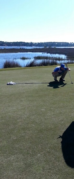 Greg Fleissner gets ready to putt.