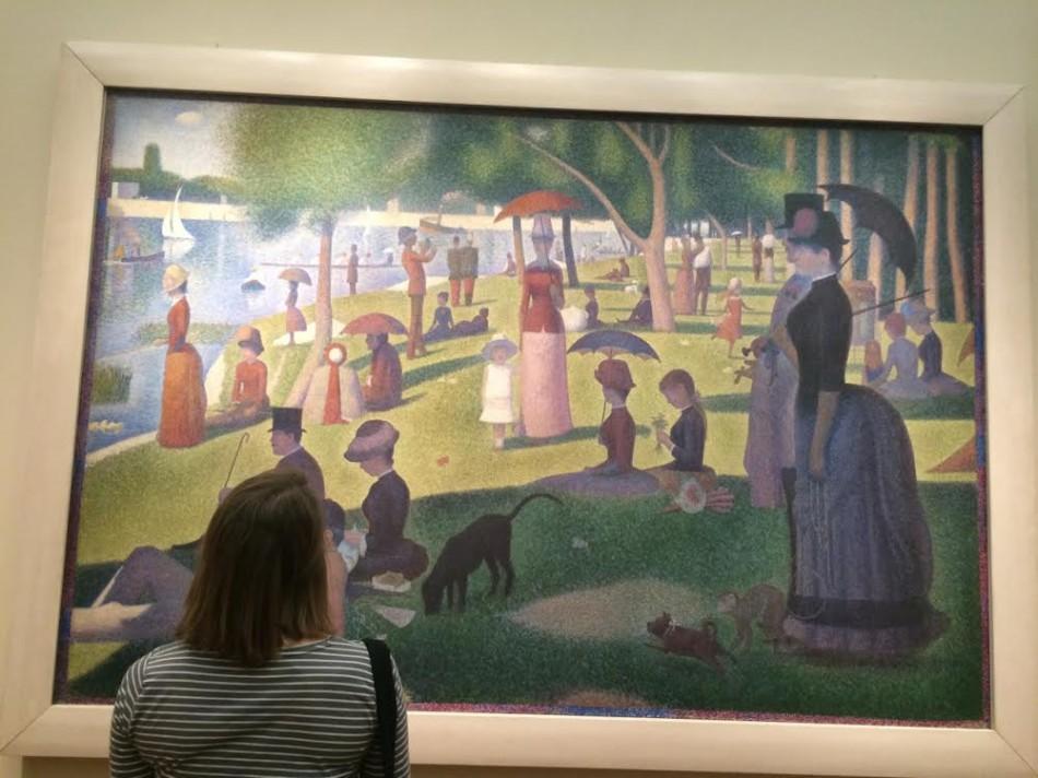 Abi Hackman, junior, looks at A Sunday Afternoon by Georges Seurat at the National Galleries.