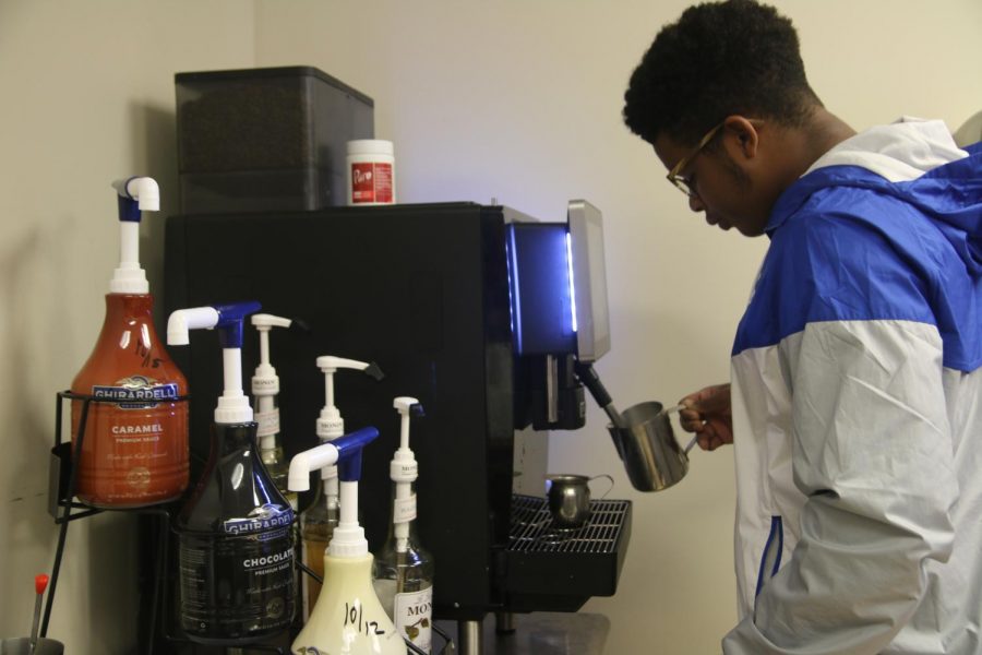 Barista Chase Mayfield prepares a cup of hot java.