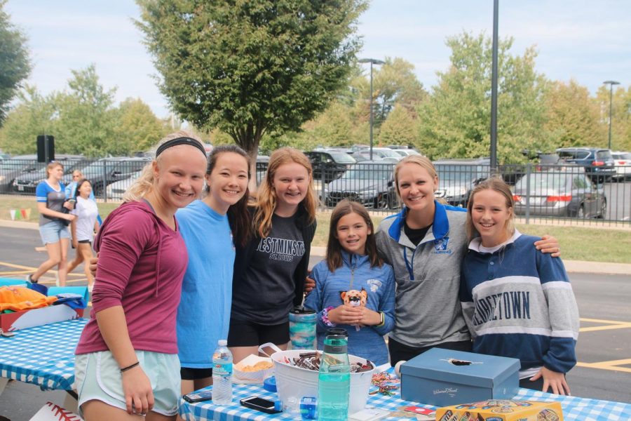 The girls' lacrosse team ran a booth where people could test their lacrosse skills. 