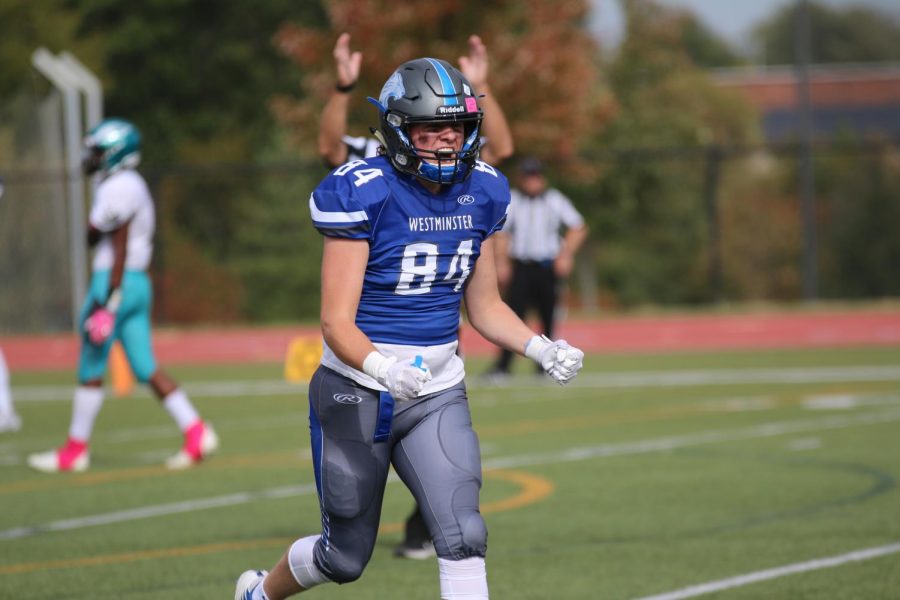 Tommy Briner celebrates after the team scores a touchdown in a game against Christian High.