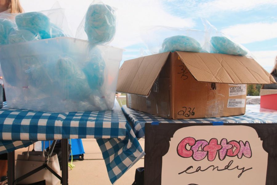 The 8th grade sold cotton candy at their booth to raise money for their class. 