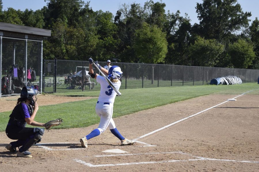 Reese Earleywine, senior, swings for the fences, something she has successfully done five times this season.