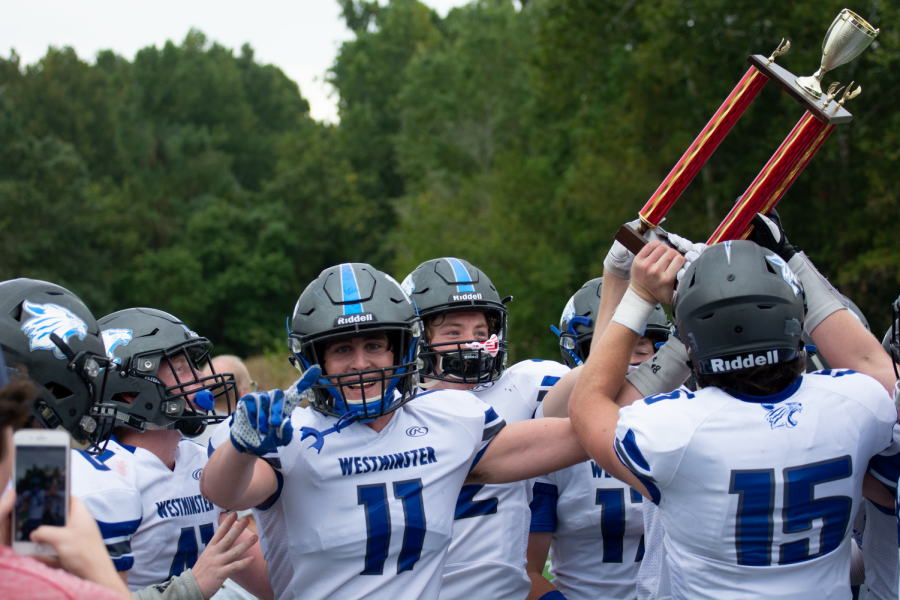 Westminster players hoist the Town and Country Cup after defeating Priory High School.