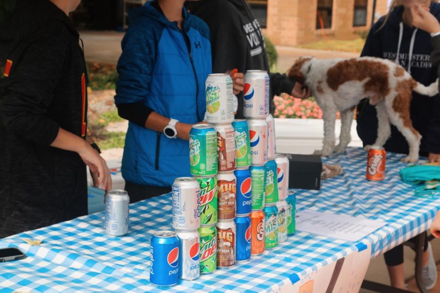 The 7th grade sold soda to benefit their class. 