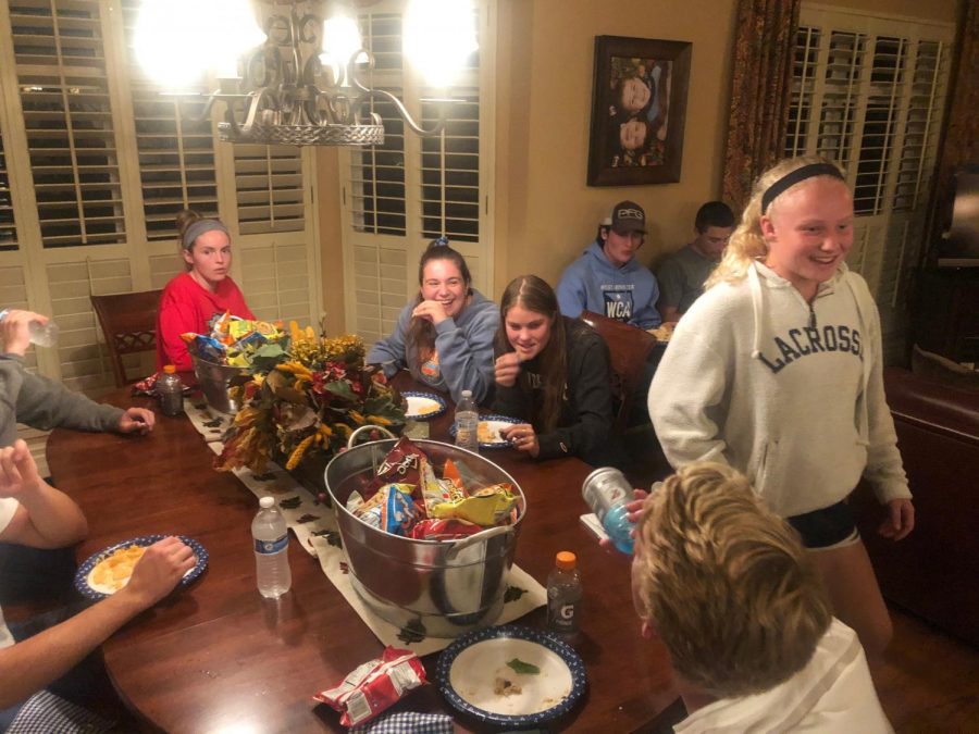 Students share laughs and dinner at an FCA meeting on a Tuesday evening.