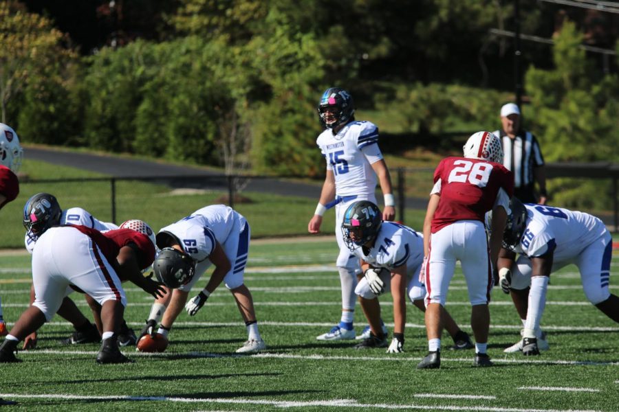 Quarterback Lane Davis barks orders to his linemen in a game against MICDS.