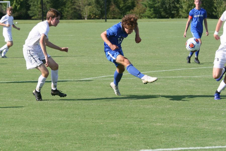 Junior Ben Van Zee kicks the ball inside the box in a game against Principia.