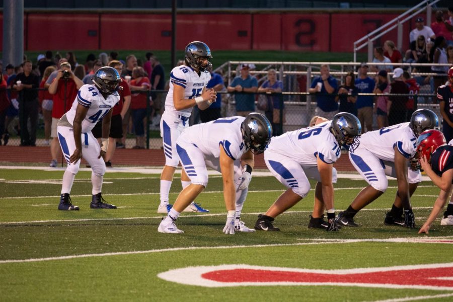 The Westminster offense lines up before the snap in a game against Liberty.