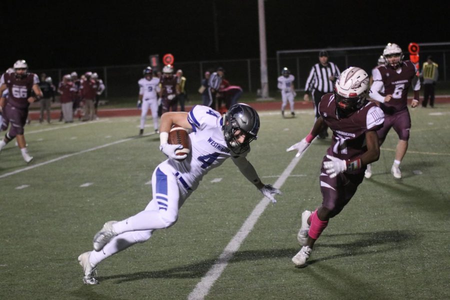 Ben Hicks, senior, makes a move with the ball in a game against St. Charles West in week nine of the regular season.