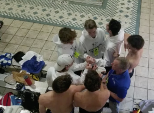 Coach Kehr preps the swim team at the state meet.