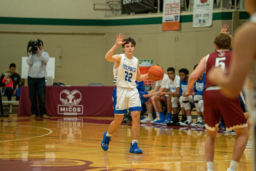 Casen Lawrence brings the ball up the court in the championship game of the MICDS Tip-Off Tournament against MICDS.