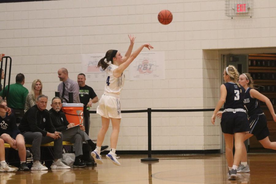 Brooke Highmark puts up a three-pointer in a game against St. Charles High school.