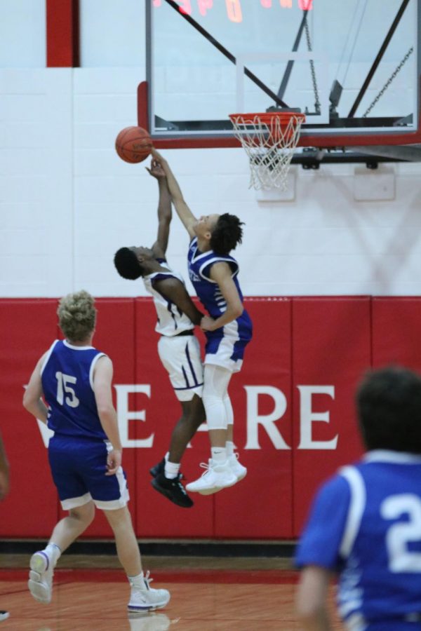 EJ Williams goes up for a big block in transition during a game against Parkway North in the Chaminade Christmas Tournament.