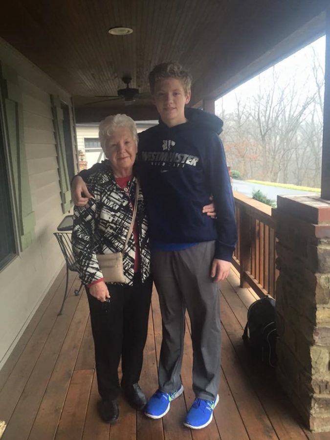 Brennan and Mrs. Beatty pose for a photo together outside his house. 