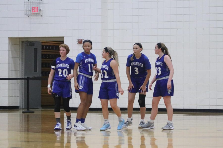 Girls basketball waits for play to resume during the Troy Tournament.