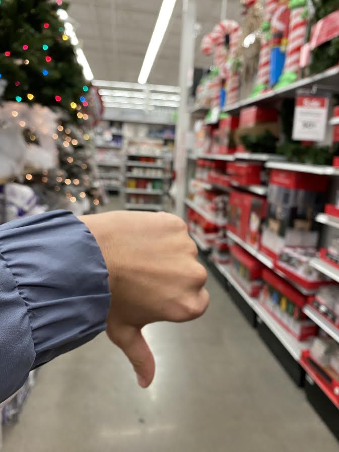 A+firm+thumbs+down+in+the+Christmas+section+of+a+retail+store.