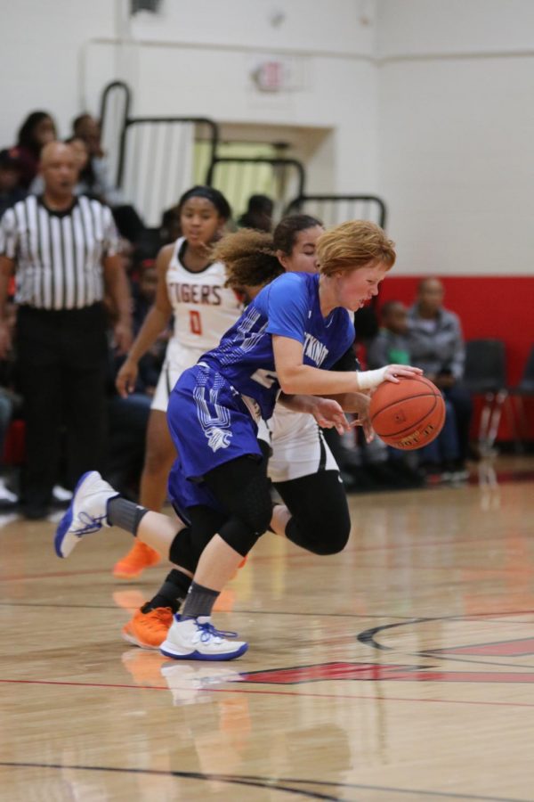 Carsyn Beachy fights to bring the ball up the court during a game against Edwardsville in the Visitation Christmas Tournament.