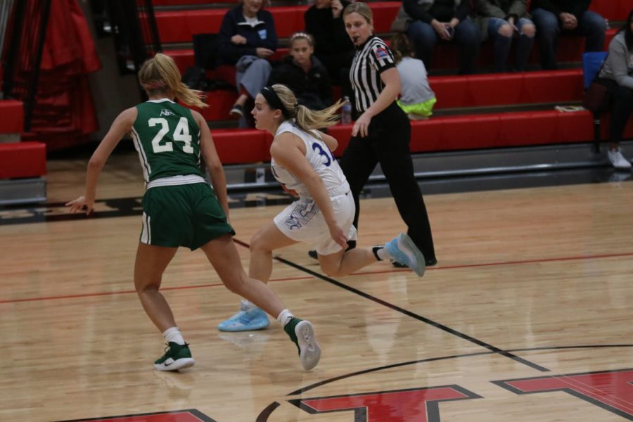 Reilly Brophy brings the ball up the court in a game against Nerinx Hall during the Visitation Christmas Tournament.