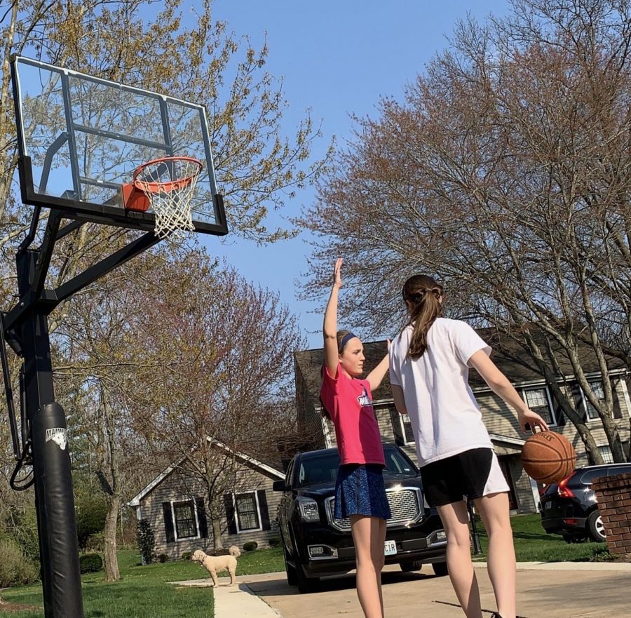 Brooke has passed the time playing basketball with her sister.