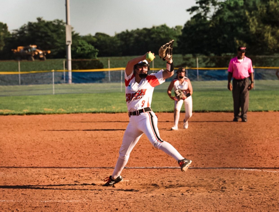 Merrifield pitches in a summer softball game for Crush.