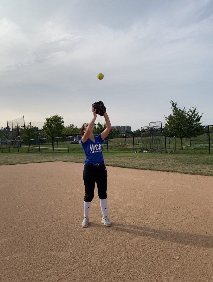 Nicki Mabry, Senior, catches fly ball at practice.