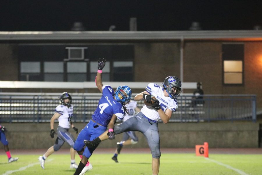 Brandon Parker, junior, catches a touchdown pass against Duchesne.