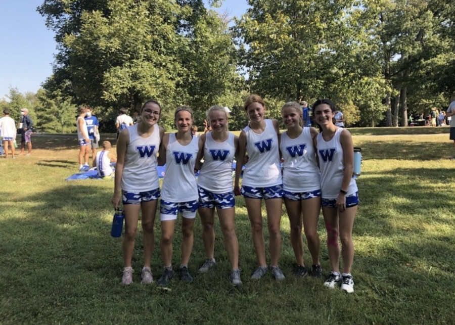 Many members of the girls team pose for a picture after a strong showing at the Priory Tri-Meet