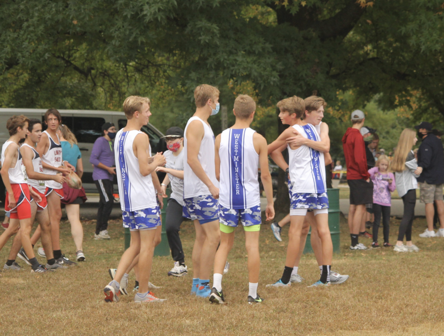 Members of the boys team congratulate each other after a tough race at the Border Wars Cross County Meet.
