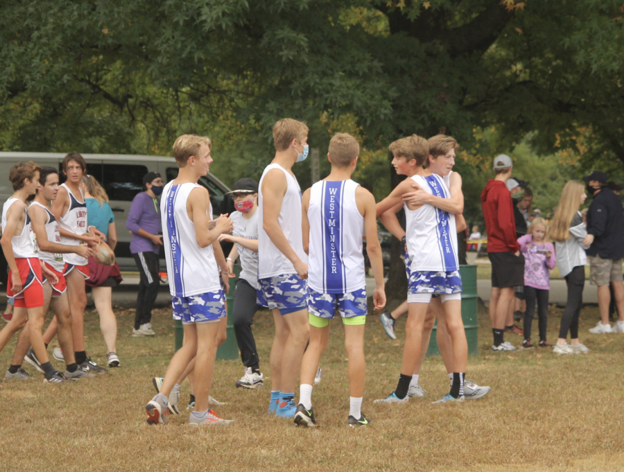 Members of the boys team congratulate each other after a tough race at the "Border Wars" Cross County Meet.