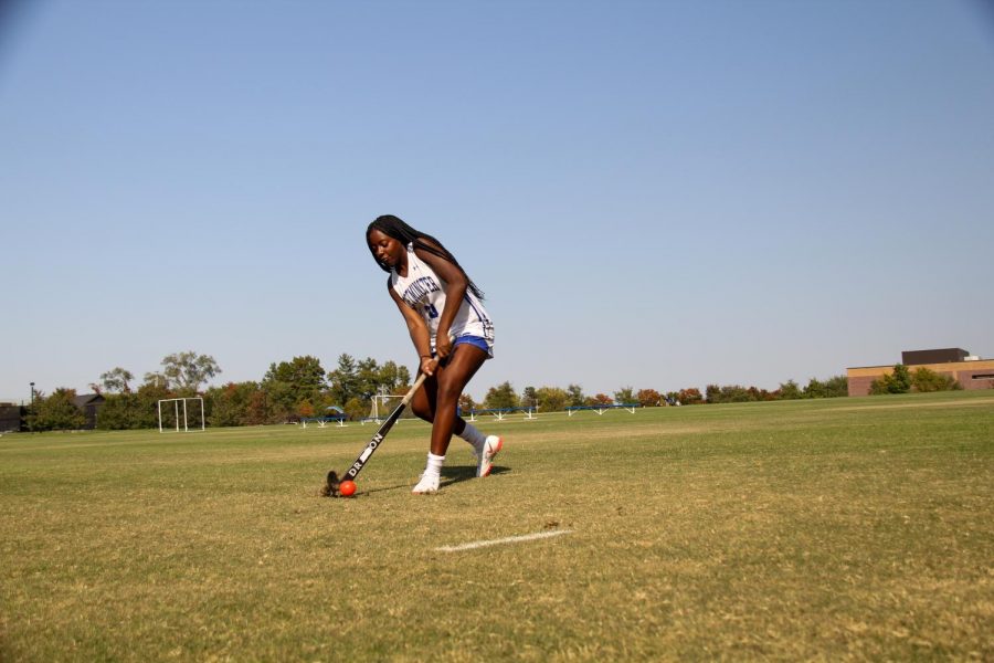 Mia+Scheulen+dribbles+the+ball+up+the+field.