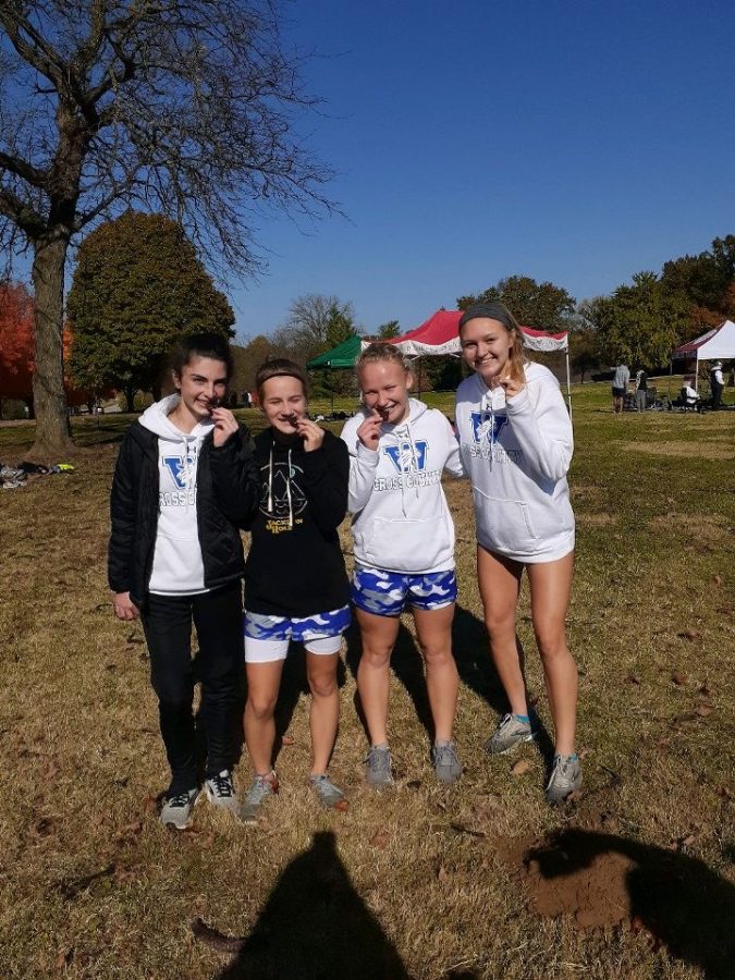 Sabrina Holohan, Kate Van Zee, Kharis Perona. and Annessa Shively pose with their All-District medals.