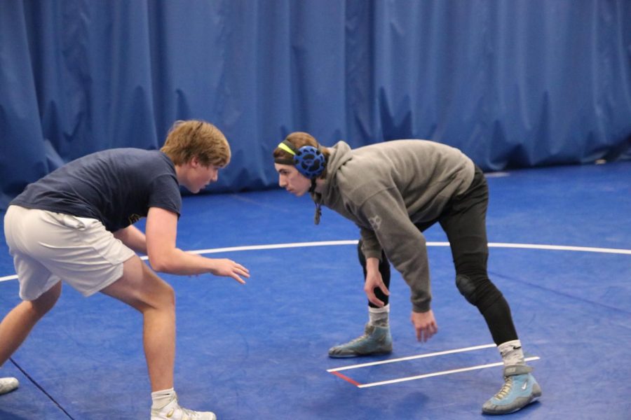 Brett. St. John and Kirk Briden, seniors, square off in practice.