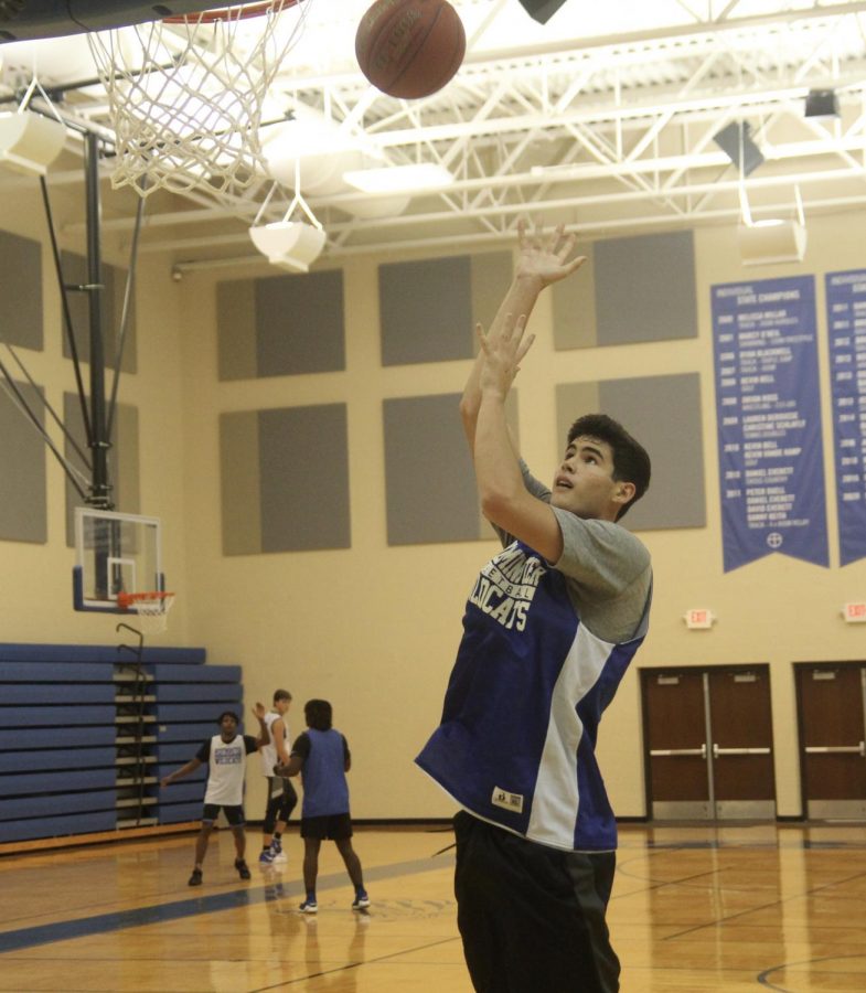 Sam Vestal, junior, shoots a hook shot in the lane. 