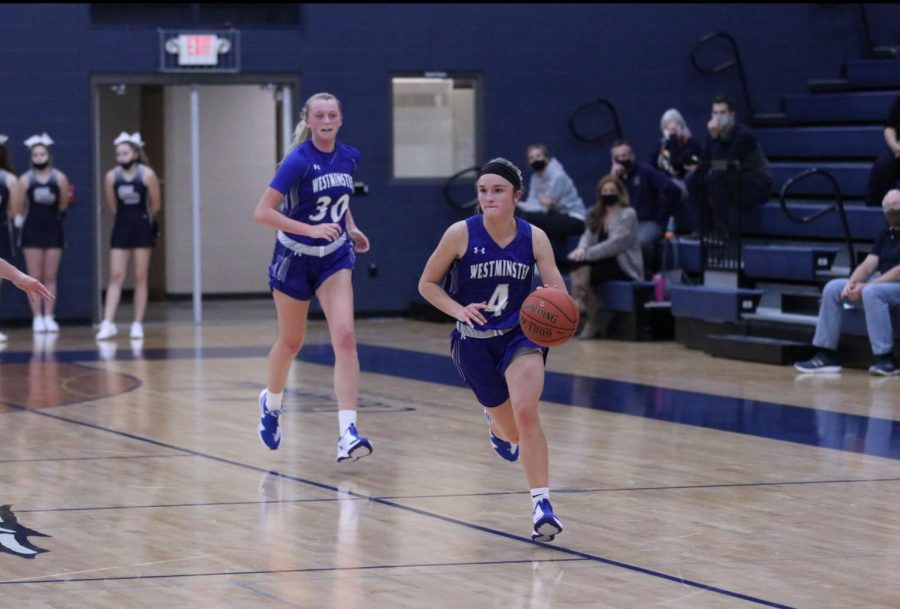 Carlie Vick trails Brooke Highmark on the way down the floor in a game against St. Dominic.