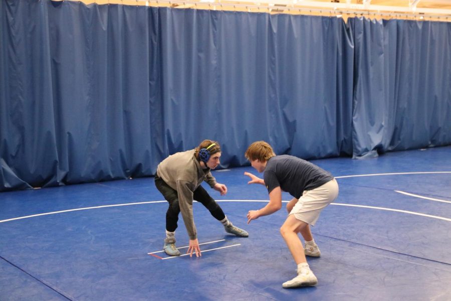 St. John (left) spars with fellow senior, Kirk Briden.