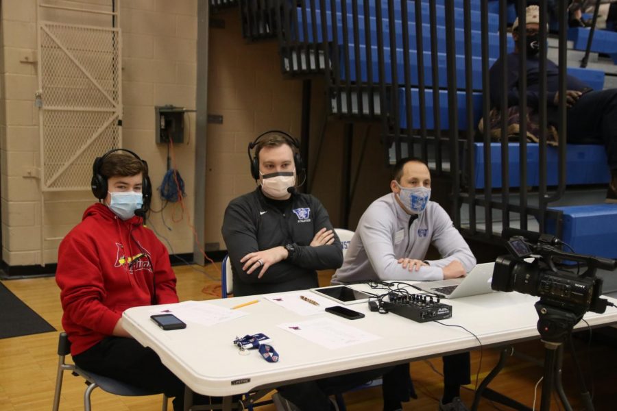 Tyler Collison helps announce the Westminster vs. Priory boys basketball game.