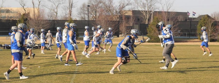 The team runs through drills to warm up at the beginning of practice.