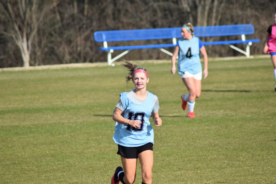 Lauren Sowers, sophomore, jogs during pratice.