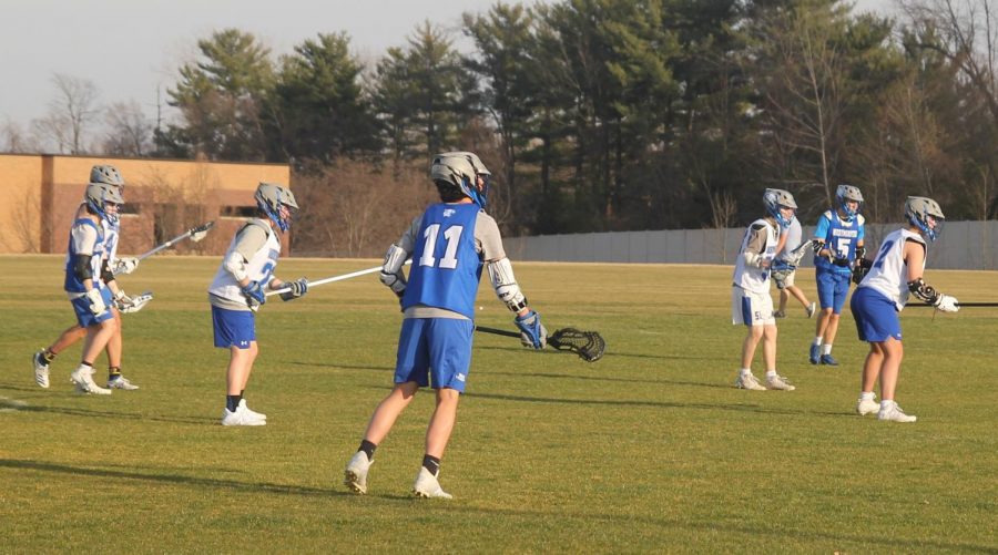 The boys lacrosse team scrimmages during a pratice.