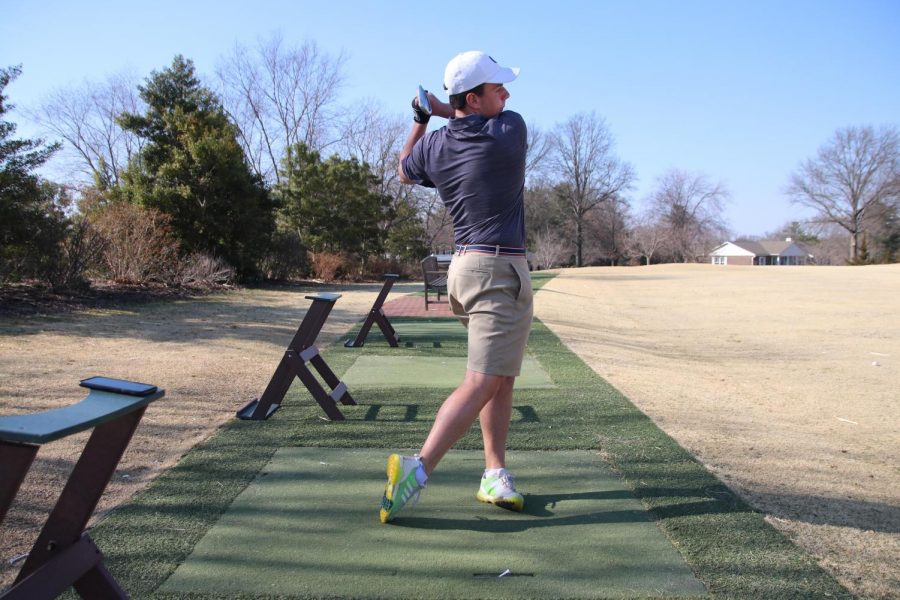 Jack Wooldridge hits balls at the range.