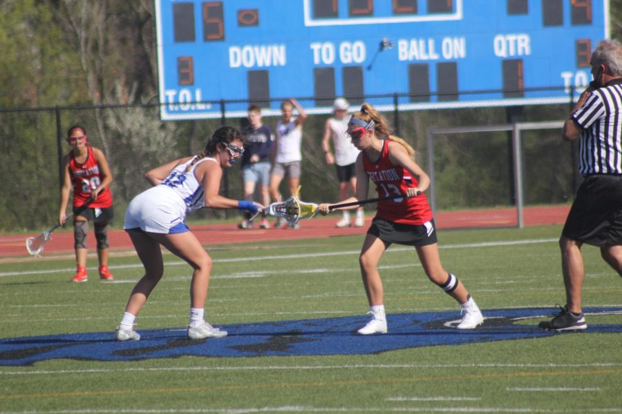 Kara Galakatos, senior, takes a draw at center field.