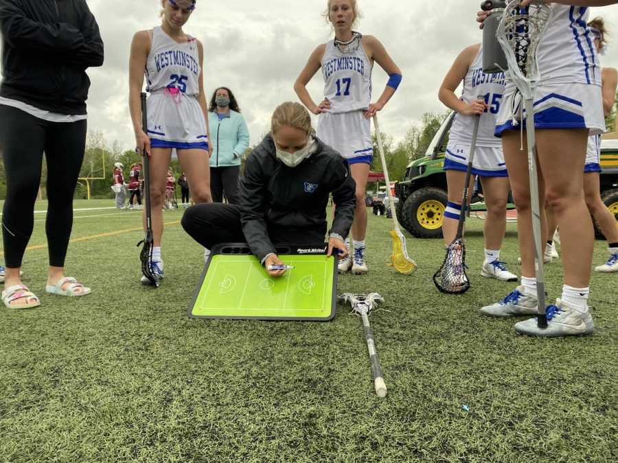 Coach Kuhn instructs her team during a timeout against MICDS.