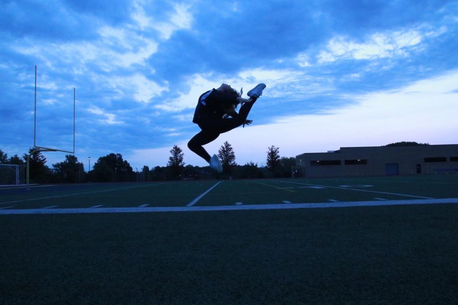 Sarah Sadler, junior, leaps for an action shot.