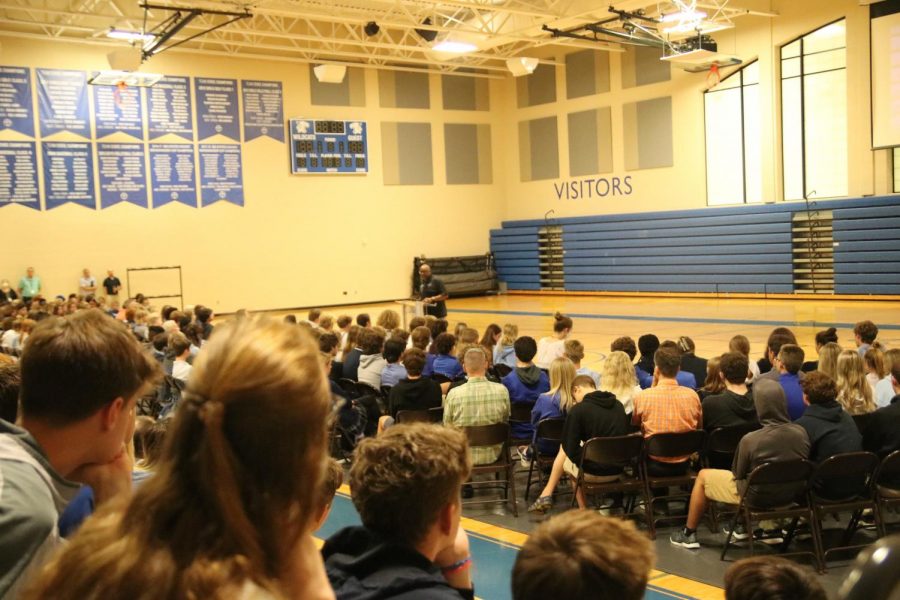 Upper school students listen to the second in-person chapel of the 2021-22 school year with Football Coach and Asst. Dean of Students, Mr. Butler B'ynote, speaking.