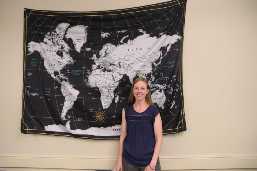 Senorita Dunn stands in her classroom.