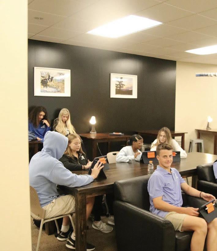 Students in the new Business Lab, learning about marketing on first day of school. 