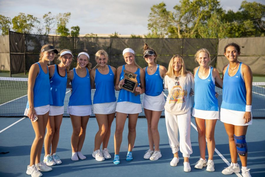 The+girls+tennis+team+poses+after+placing+first+in+their+district.