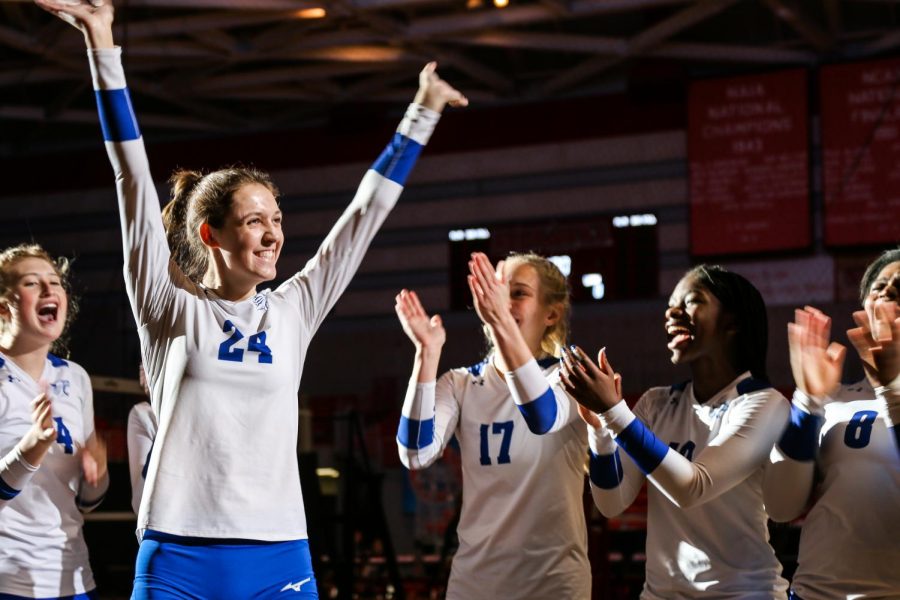 Lexie Vick, senior, waves to the crowd as her name is announced.